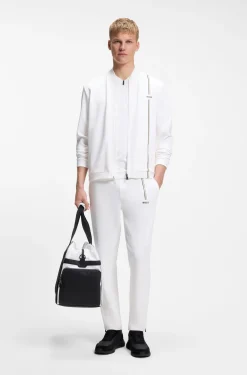 Active tracksuit bottoms in thermoregulating stretch gabardine