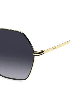 Angular sunglasses in black and gold-tone steel