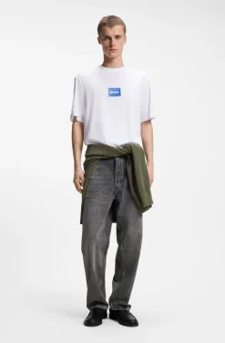Baggy-fit black jeans with carpenter details