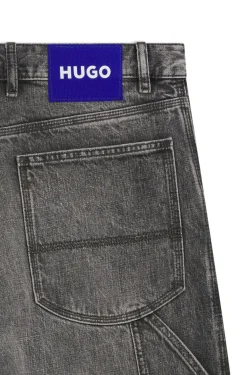 Baggy-fit black jeans with carpenter details