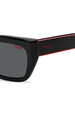 Black-acetate sunglasses with signature-red layered temples