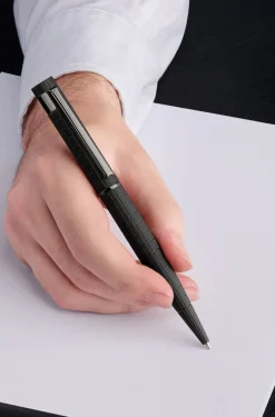 Black grid-textured ballpoint pen with logo trim