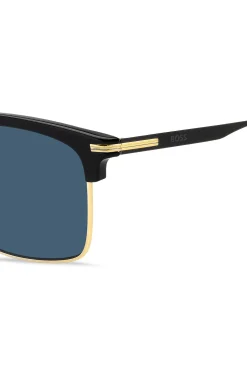 Blue-lens sunglasses with black and gold-tone frames