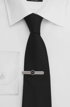 Brass tie clip with round logo detail