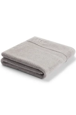 Cotton bath mat in silver with embroidered logo