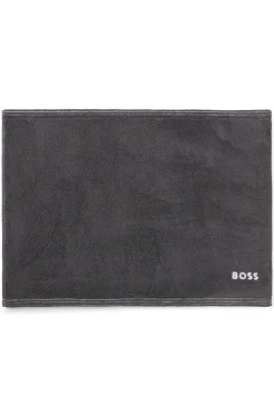 Cotton bath mat with contrast embroidered logo