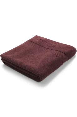 Cotton bath mat with embroidered logo
