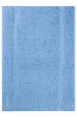 Cotton bath mat with embroidered logo