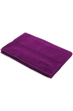 Cotton bath mat with embroidered logo