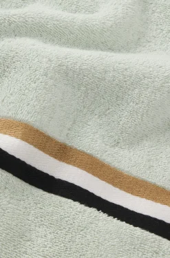 Cotton bath towel with signature-stripe border