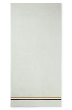 Cotton bath towel with signature-stripe border