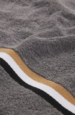 Cotton bath towel with signature-stripe border