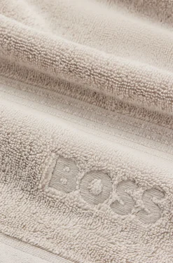 Cotton bath towel with tonal embroidered logo