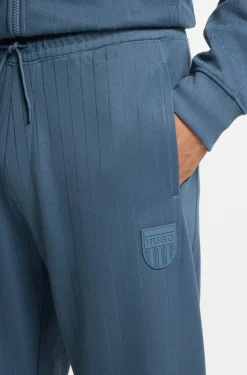 Cotton-blend tracksuit bottoms with drop-needle stripe