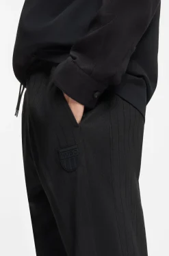 Cotton-blend tracksuit bottoms with drop-needle stripe