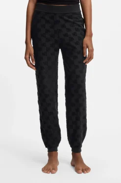 Cotton-blend tracksuit bottoms with all-over logo pattern