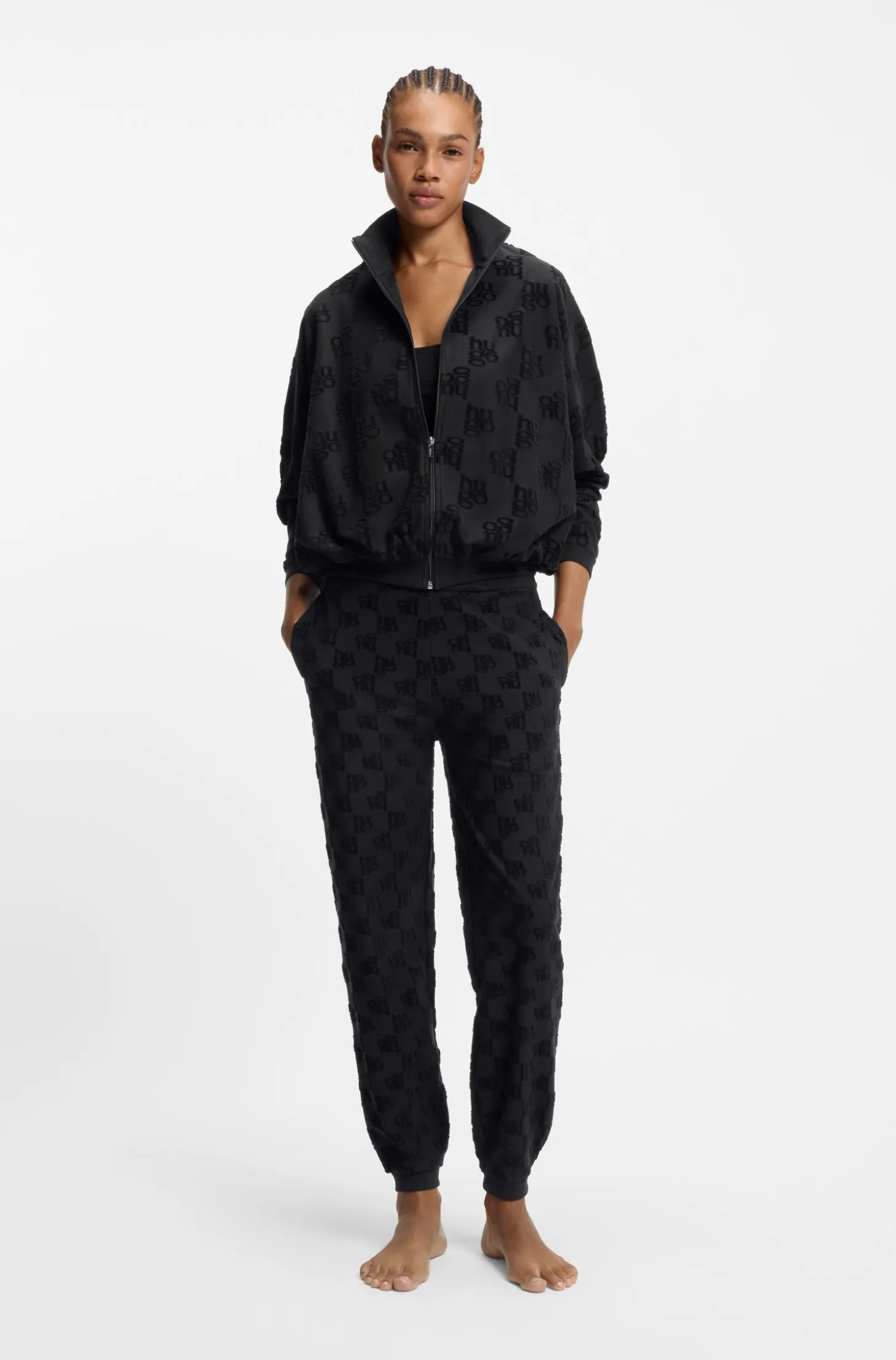 Cotton-blend tracksuit bottoms with all-over logo pattern