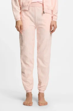Cotton-blend tracksuit bottoms with all-over logo pattern