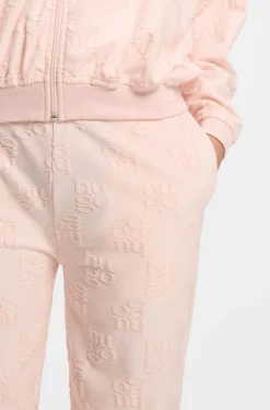 Cotton-blend tracksuit bottoms with all-over logo pattern
