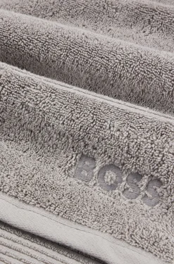 Cotton guest towel in silver with embroidered logo
