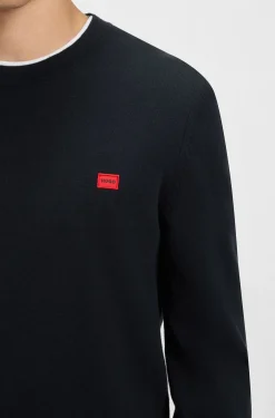 Cotton sweater with red logo label