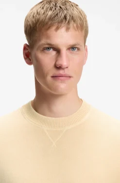 Cotton sweater with ribbed side seams