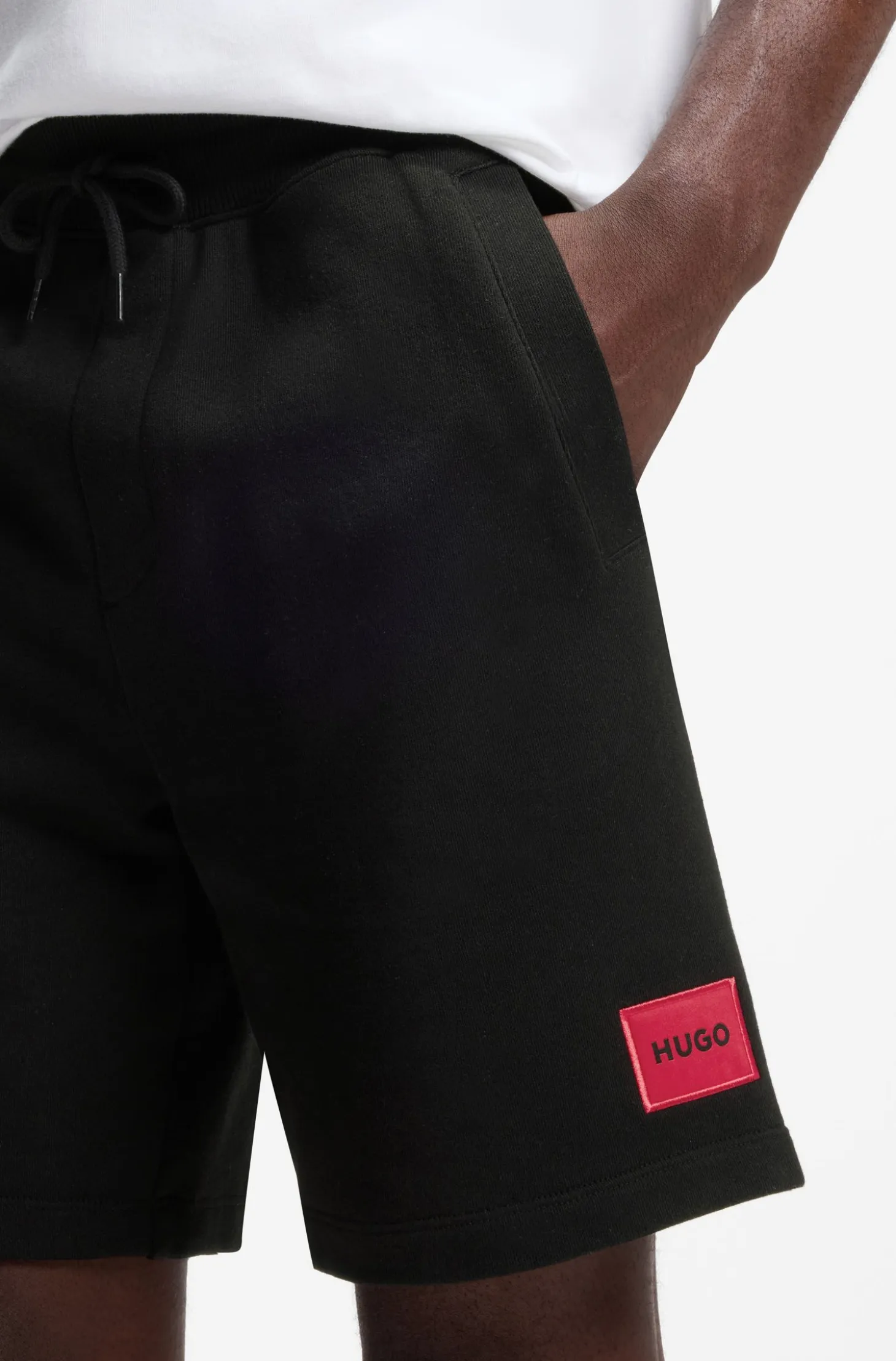 Cotton-terry shorts with red logo label