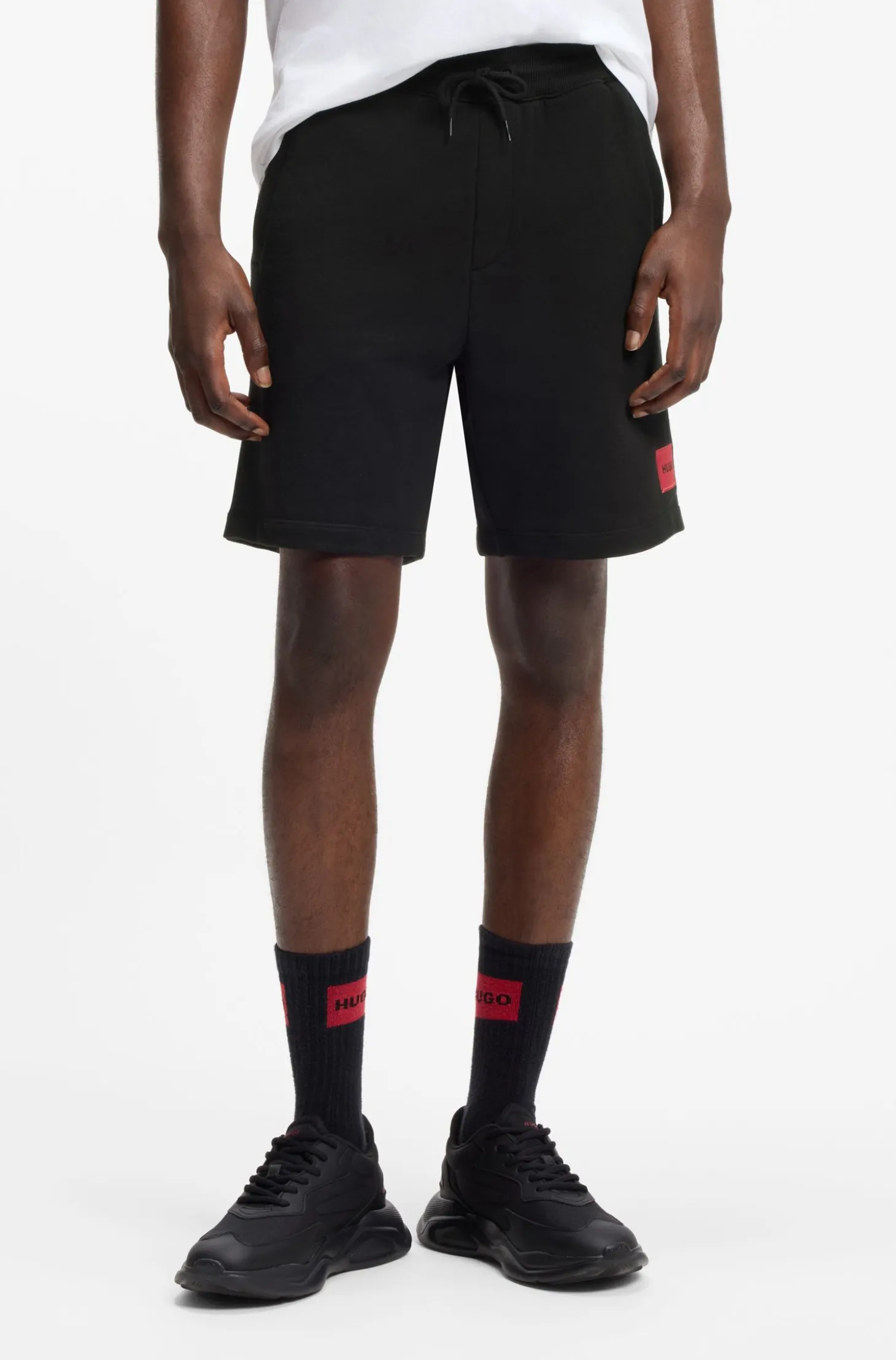 Cotton-terry shorts with red logo label