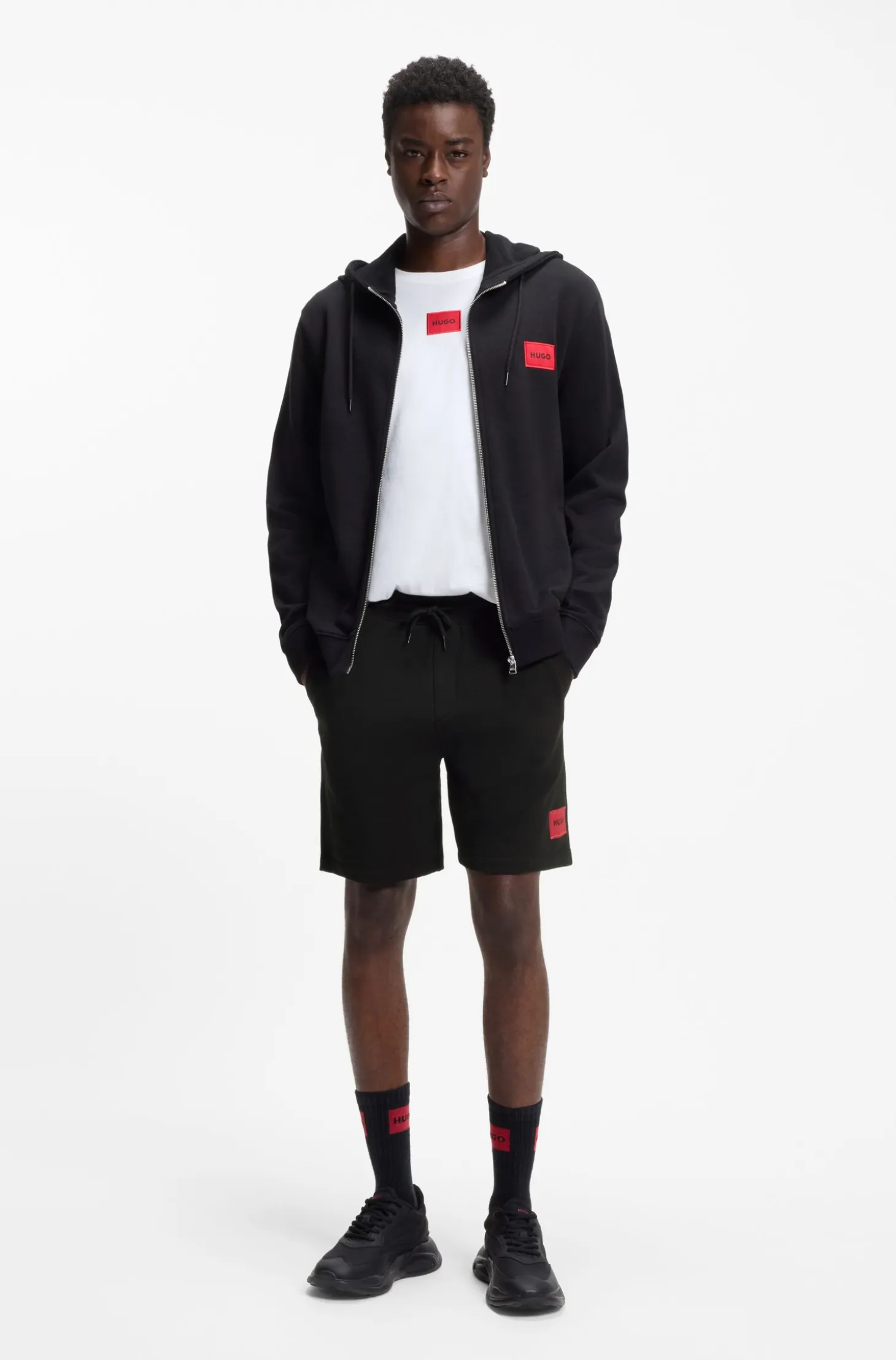 Cotton-terry shorts with red logo label