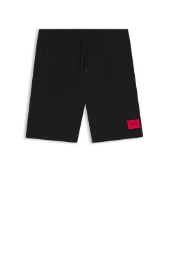 Cotton-terry shorts with red logo label