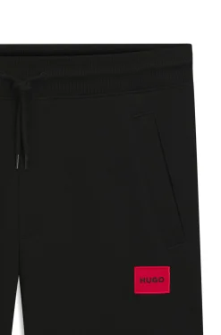 Cotton-terry tracksuit bottoms with red logo label