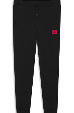 Cotton-terry tracksuit bottoms with red logo label