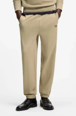Cotton-terry tracksuit bottoms with logo badge