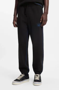 Cotton-terry tracksuit bottoms with logo and contrast stitching