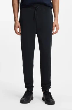 Cotton-terry tracksuit bottoms with logo patch