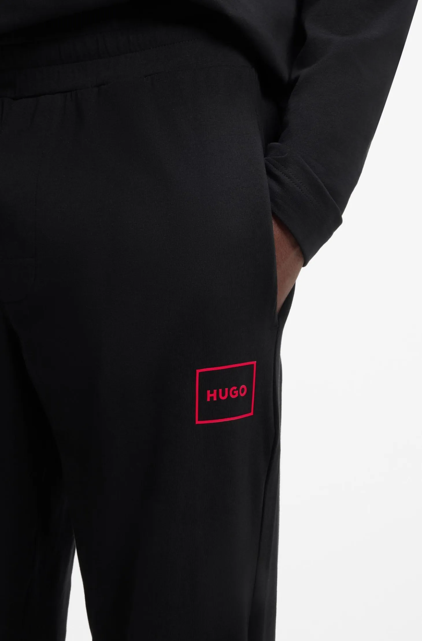 Cuffed loungewear bottoms in stretch cotton with logo print