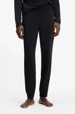 Cuffed loungewear bottoms in stretch cotton with logo print