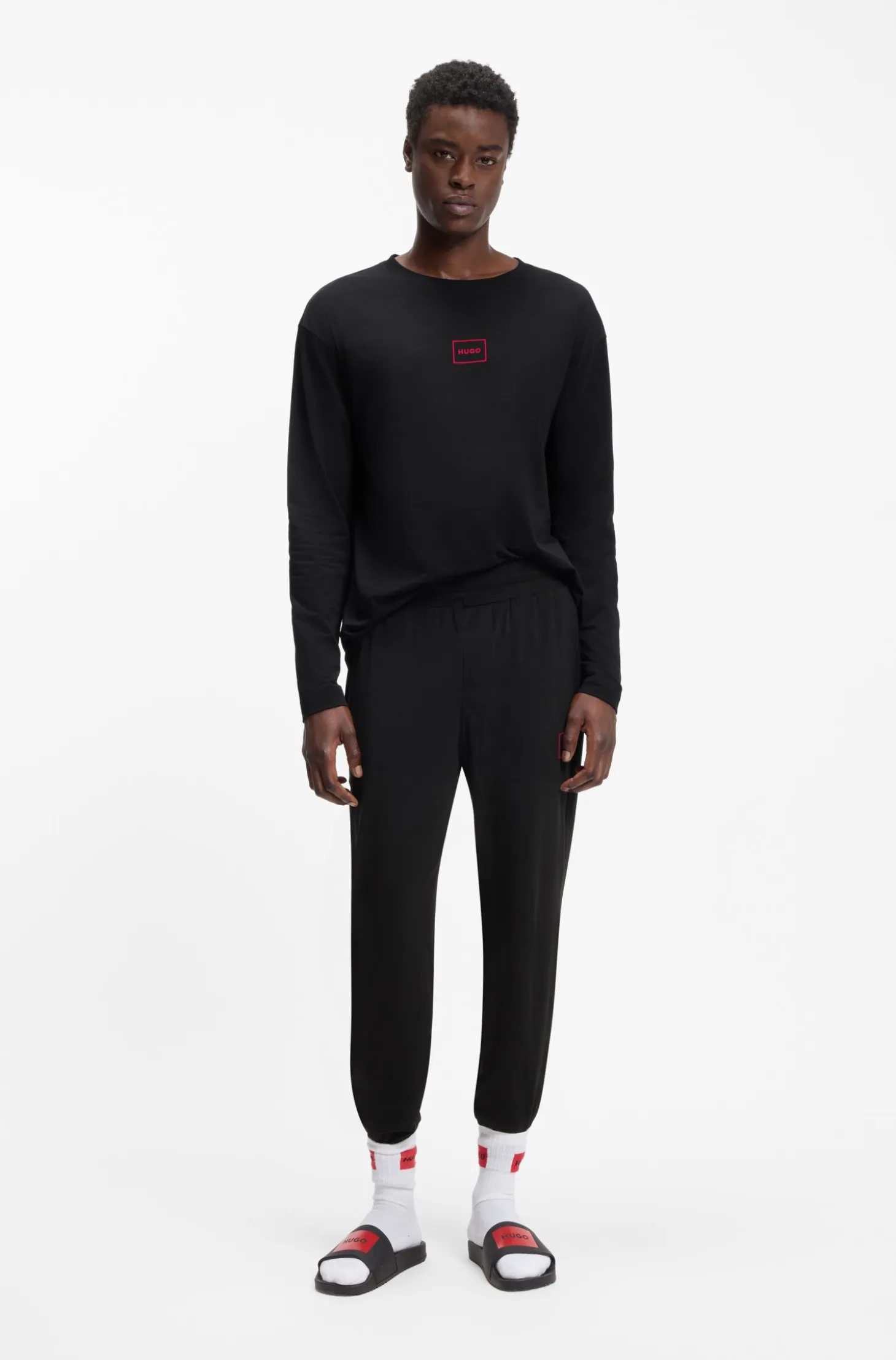 Cuffed loungewear bottoms in stretch cotton with logo print