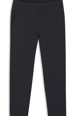Drawstring trousers in stretch waffle fabric with framed zip