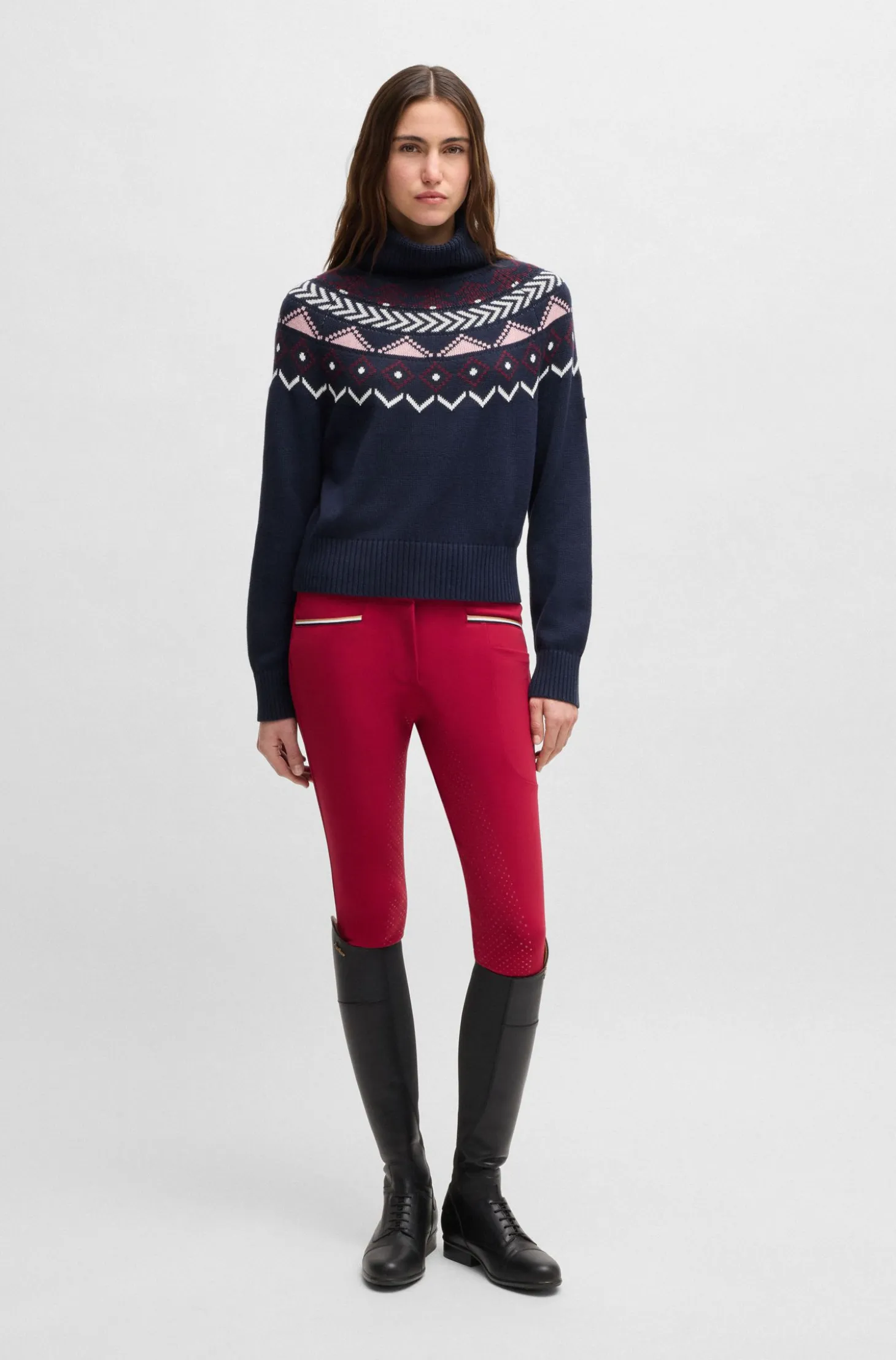 Equestrian rollneck sweater with knitted pattern