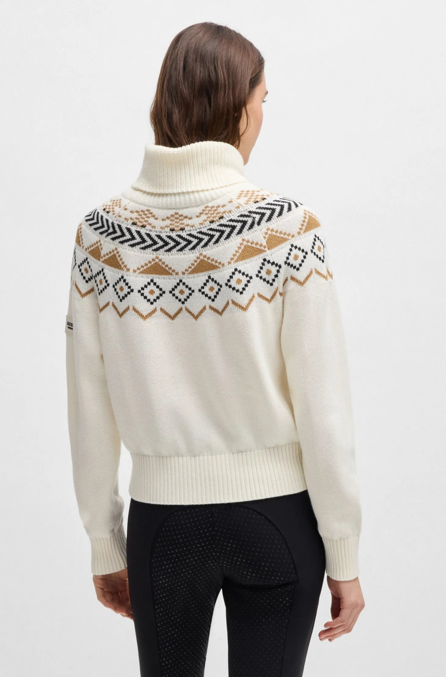 Equestrian rollneck sweater with knitted pattern