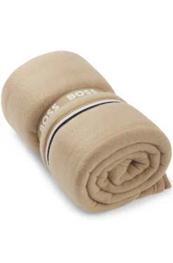 Fleece throw with signature-stripe ribbon