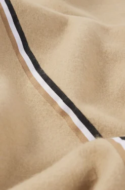 Fleece throw with signature-stripe ribbon