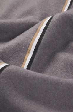 Fleece throw with signature-stripe ribbon