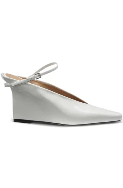 Glossy leather mules with wedge heel and strap