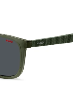 Green sunglasses with patterned temples
