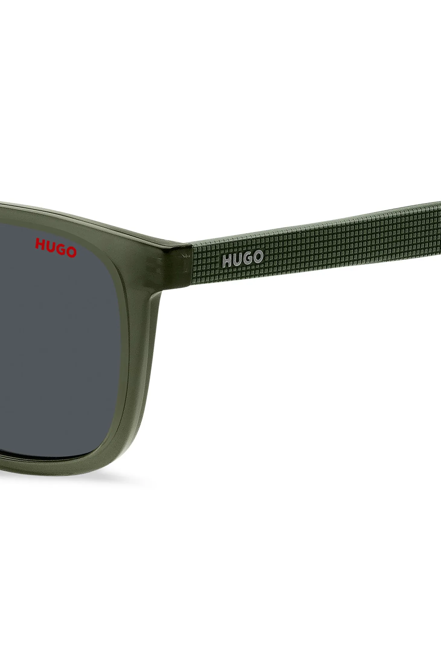 Green sunglasses with patterned temples