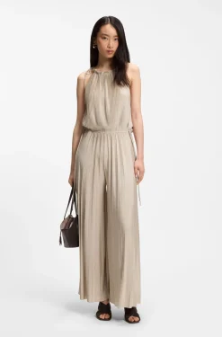 Halterneck jumpsuit in lustrous jersey with plissé pleats