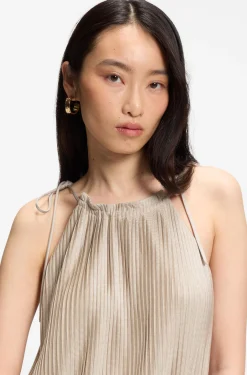 Halterneck jumpsuit in lustrous jersey with plissé pleats