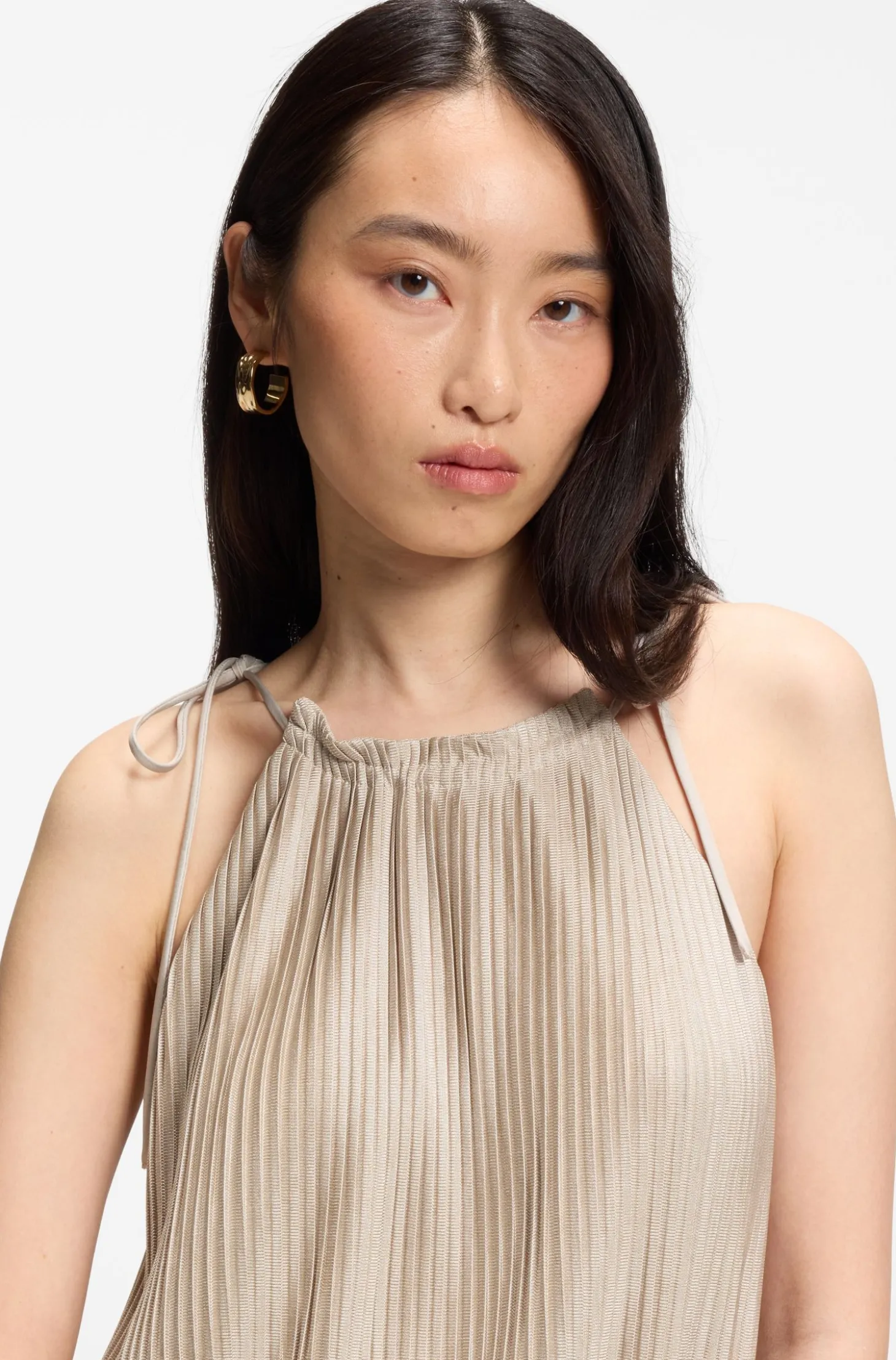 Halterneck jumpsuit in lustrous jersey with plissé pleats